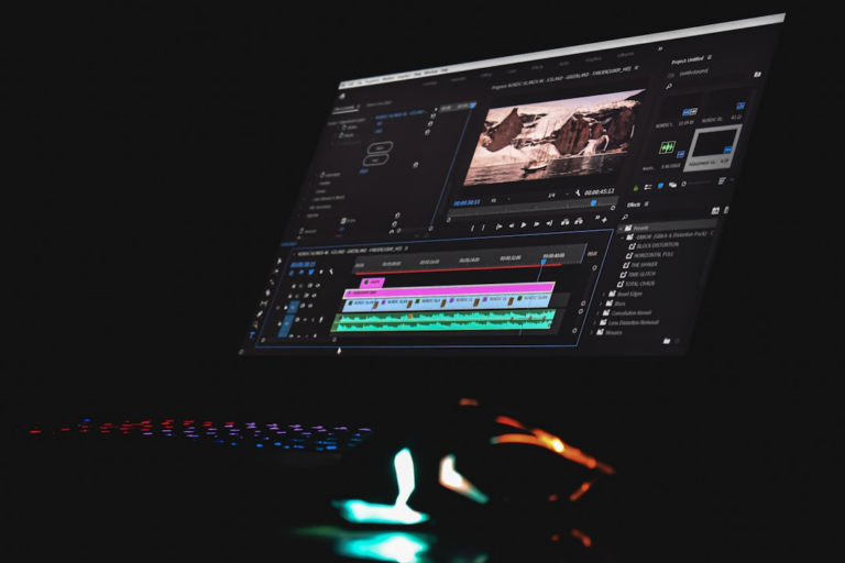 A computer monitor displaying video editing software with a timeline and preview window — Foto por Sanjeev Nagaraj na Unsplash